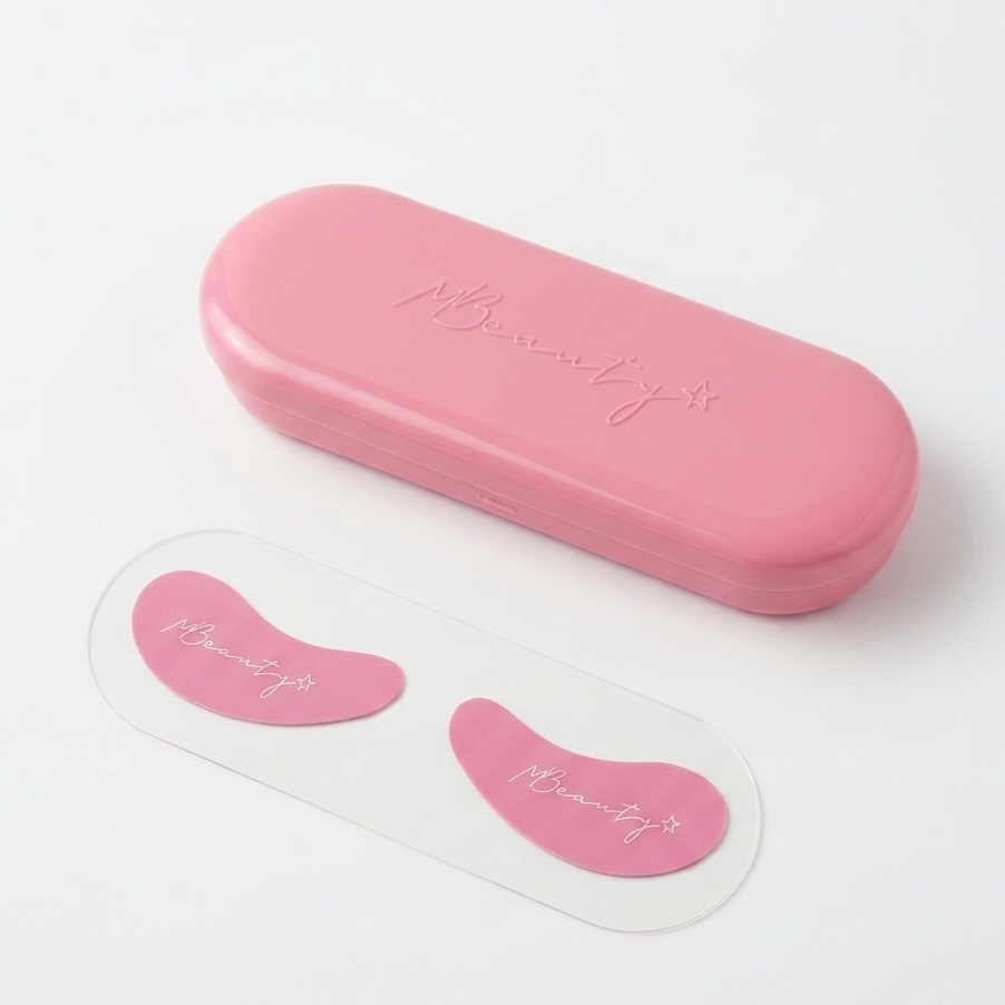Pink beauty product case with two pink eye patches on a white background